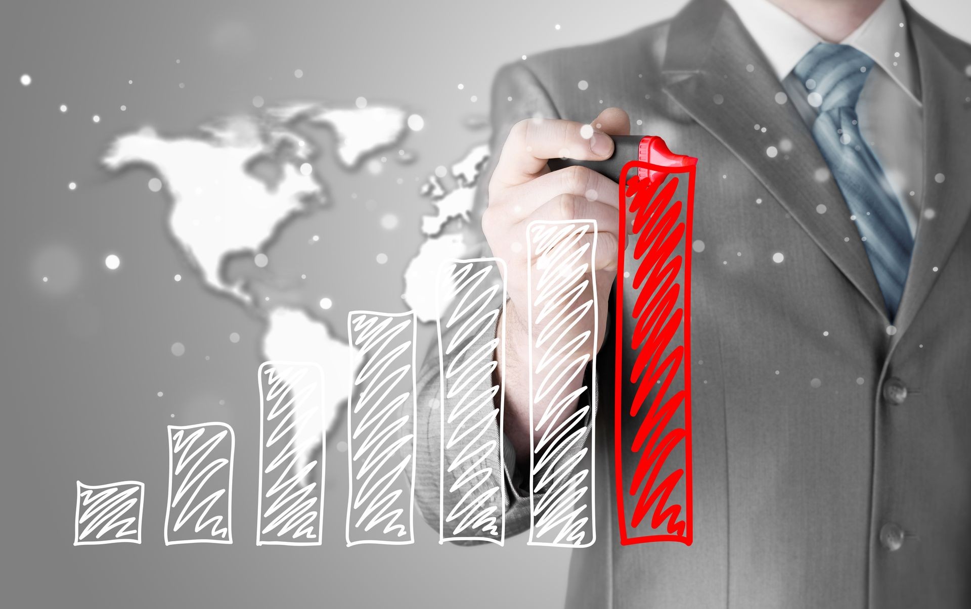 Business man drawing a growing graph Business man drawing a growing graph